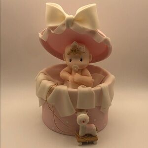 Adorable Baby Figurine in Pink Round Box Cake Topper